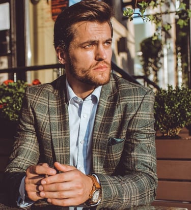 a sugar daddy in a suit and a watch